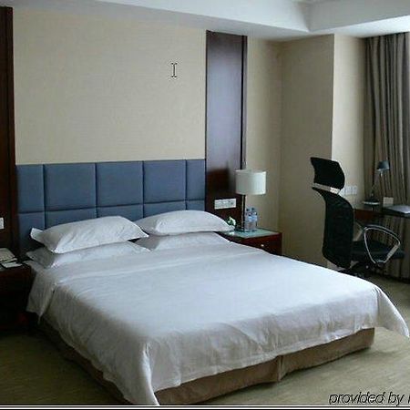 New Land Business Hotel Wuhan Zimmer foto