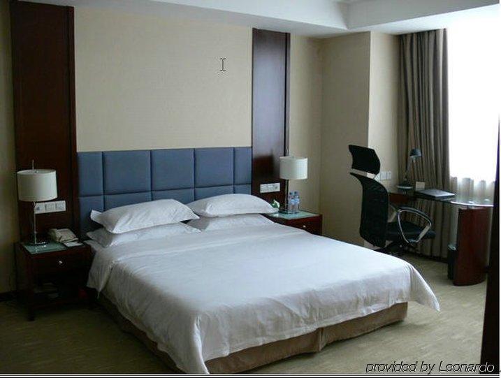 New Land Business Hotel Wuhan Zimmer foto